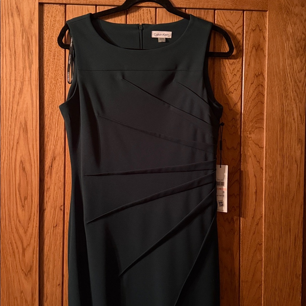 Calvin Klein deep green, tummy smoothing and waist shaping dress. Great staple!